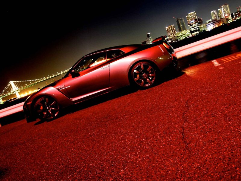 Красный автомобиль на красивом фоне