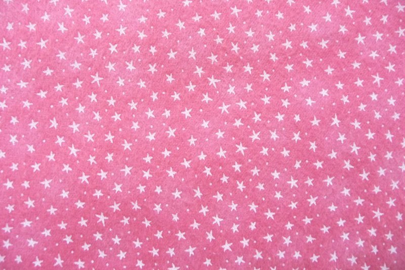 Ткань звезды на розовом фоне